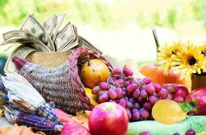 Cornucopia with fruits, flowers & dollar bills symbolizing fruitful financial actions in Bedford, NH 